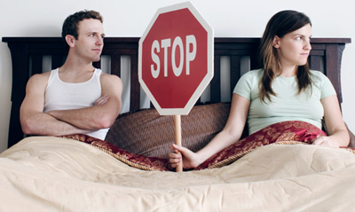 Couple disconnected in bed